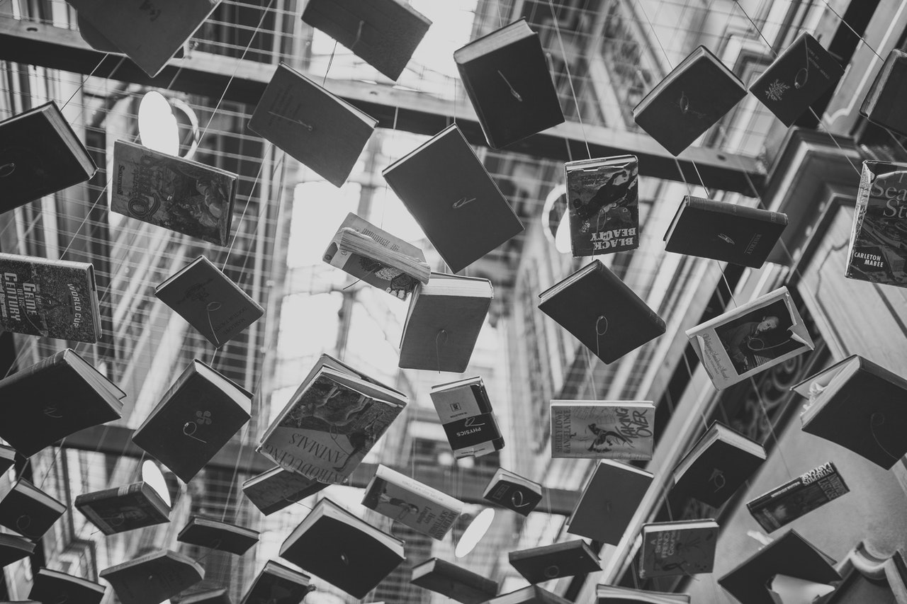 Black & White; books strewn across an overhead window